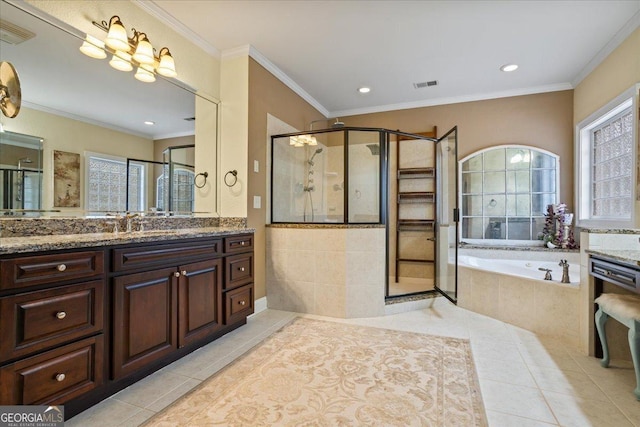 bathroom with tile patterned flooring, visible vents, and ornamental molding