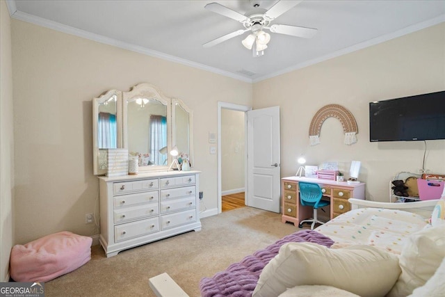 bedroom featuring ornamental molding, light colored carpet, ceiling fan, and baseboards