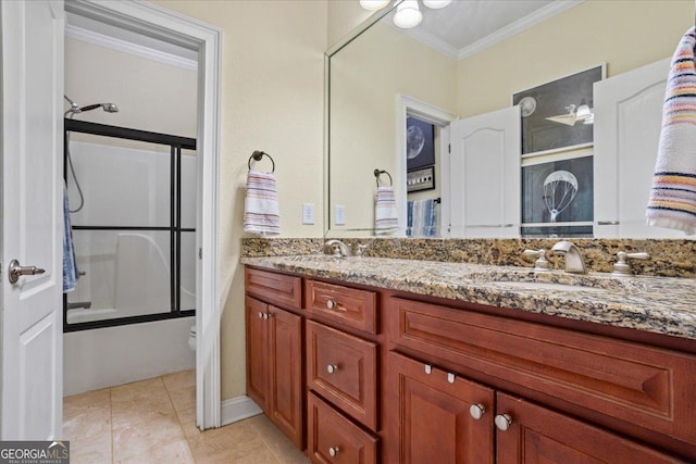 full bath featuring enclosed tub / shower combo, tile patterned flooring, toilet, double vanity, and crown molding