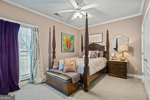 bedroom featuring a ceiling fan, visible vents, crown molding, and light carpet