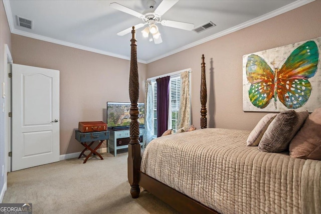 carpeted bedroom featuring baseboards, visible vents, ceiling fan, and crown molding