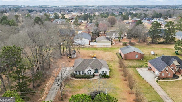 birds eye view of property with a residential view