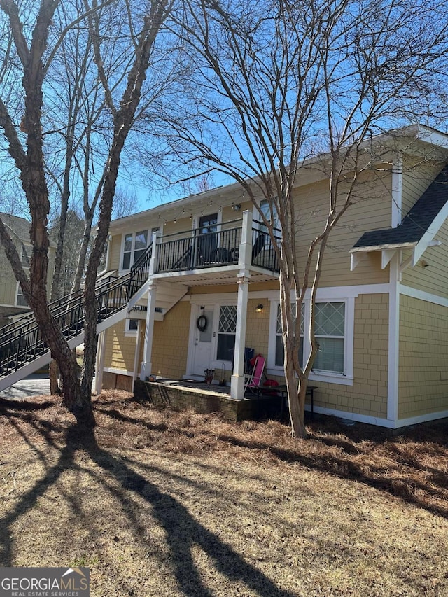 view of front of house featuring stairway