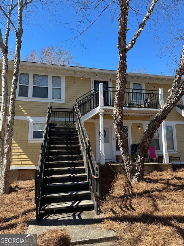 view of front of house featuring stairs