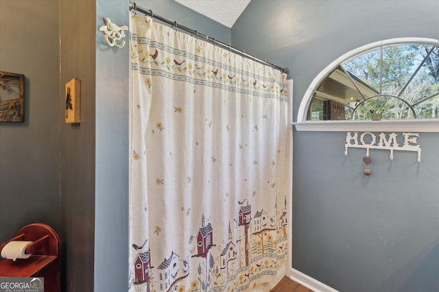 bathroom with curtained shower