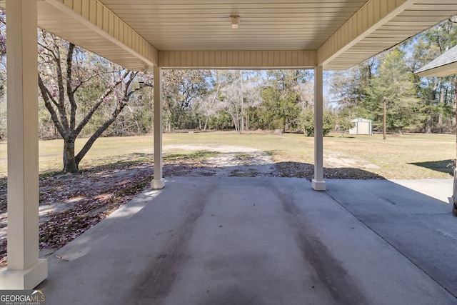view of patio / terrace with a storage shed and an outdoor structure