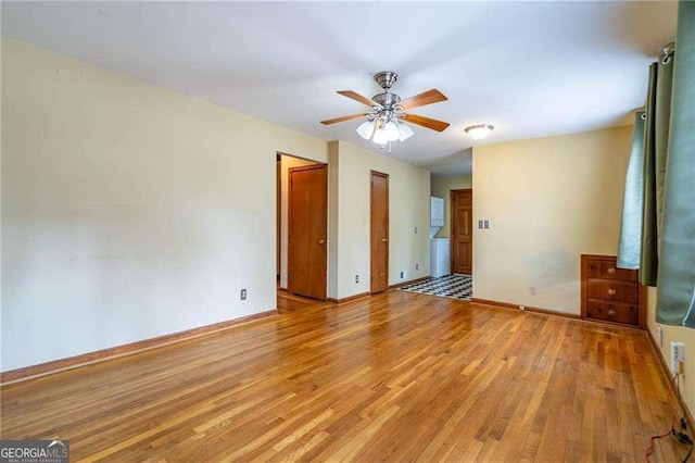 unfurnished bedroom with a ceiling fan, baseboards, and light wood finished floors