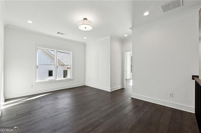 unfurnished living room with crown molding, baseboards, visible vents, and dark wood-style flooring