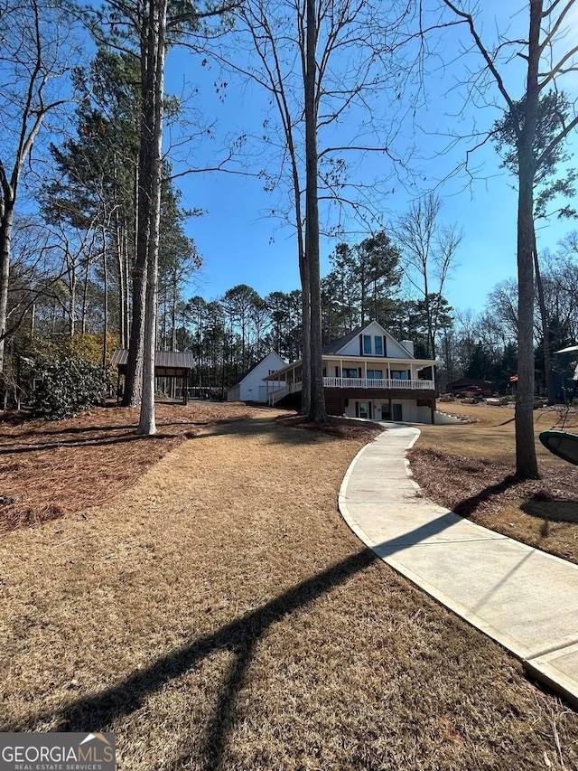 view of front facade with a wooden deck