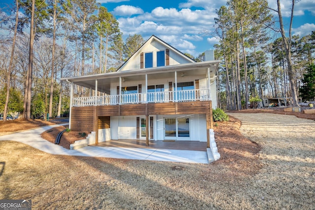 view of front of property with a patio area and ceiling fan