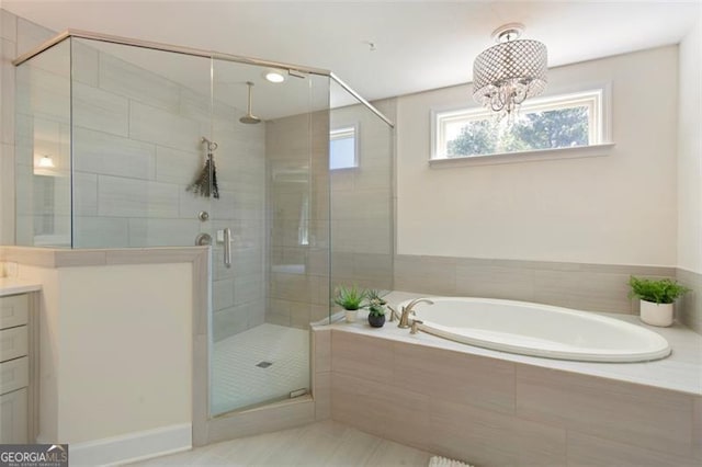 full bath with a bath, a shower stall, and vanity