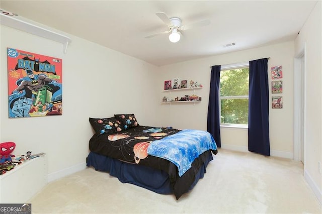 carpeted bedroom featuring ceiling fan and baseboards