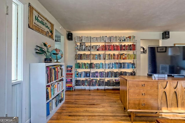 sitting room featuring wood finished floors