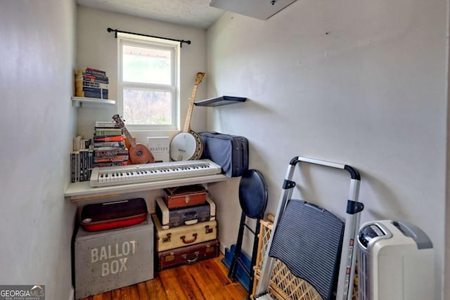 miscellaneous room featuring wood finished floors