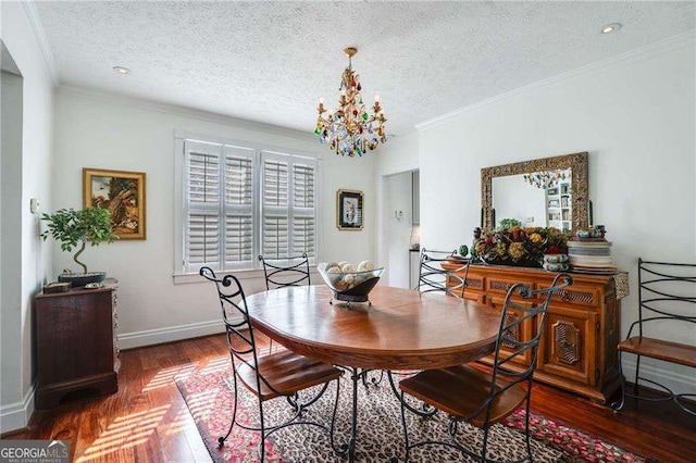 dining area with ornamental molding, an inviting chandelier, baseboards, and wood finished floors