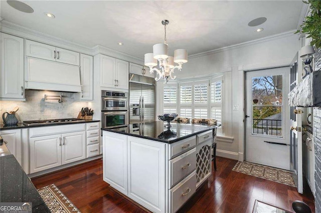 kitchen featuring premium range hood, white cabinetry, stainless steel appliances, and dark wood-type flooring