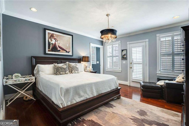 bedroom with ornamental molding, access to exterior, baseboards, and wood finished floors