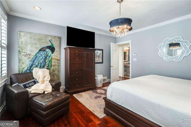 bedroom with a notable chandelier, baseboards, wood finished floors, and crown molding