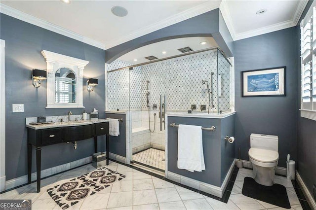 bathroom with baseboards, a shower stall, toilet, and crown molding