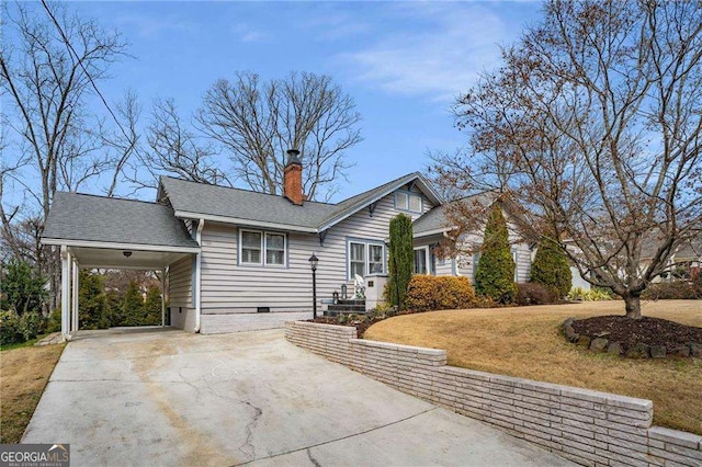 view of front of house featuring concrete driveway, a chimney, crawl space, a front lawn, and a carport