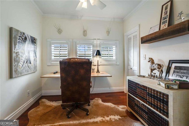 office space with baseboards, ornamental molding, ceiling fan, and wood finished floors