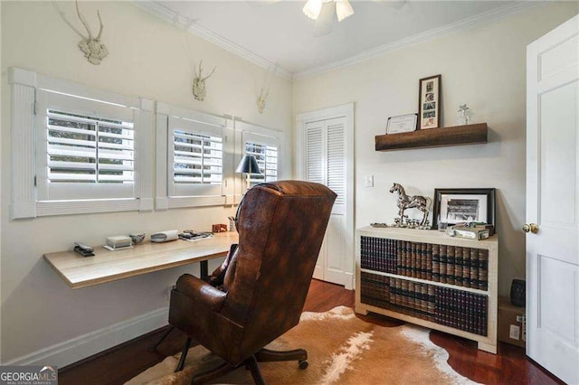 office space with baseboards, ceiling fan, wood finished floors, and crown molding