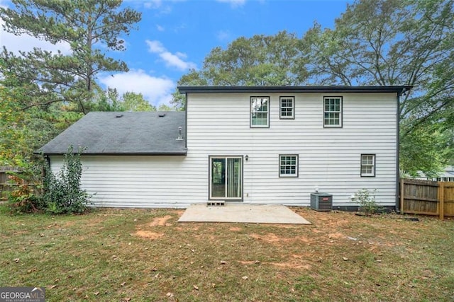 back of house featuring a yard, a patio area, fence, and central air condition unit