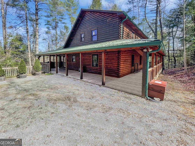 view of side of property with metal roof