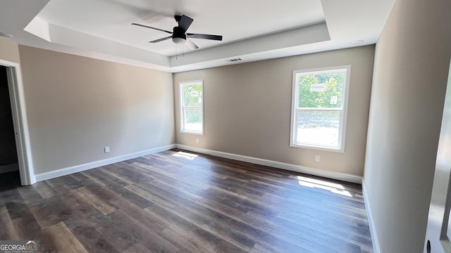 160 Coffey Rd Unit 18, Barnesville, GA 30204 - unfurnished room featuring a raised ceiling, plenty of natural light, ceiling fan, and dark wood-type flooring