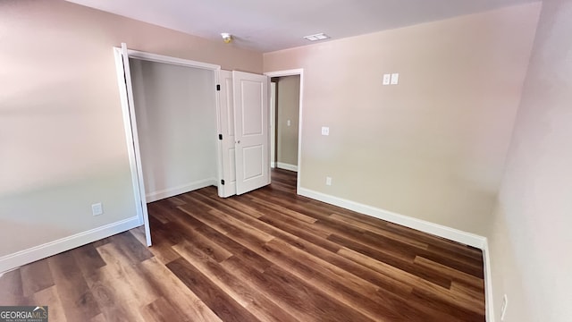 160 Coffey Rd Unit 18, Barnesville, GA 30204 - unfurnished bedroom with dark wood-type flooring and a closet