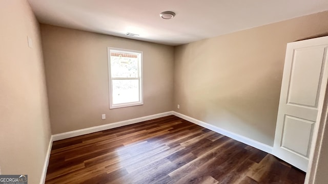 160 Coffey Rd Unit 18, Barnesville, GA 30204 - empty room featuring dark wood-type flooring and baseboards