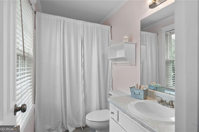 full bathroom featuring ornamental molding, a shower with shower curtain, vanity, and toilet