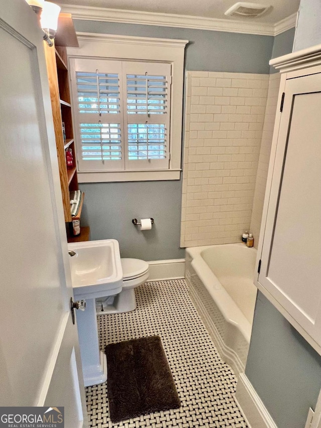 full bathroom with baseboards, visible vents, toilet, ornamental molding, and a sink