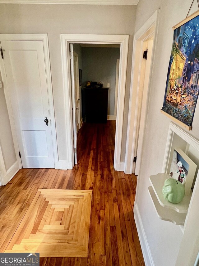 bonus room with lofted ceiling, baseboards, and hardwood / wood-style flooring