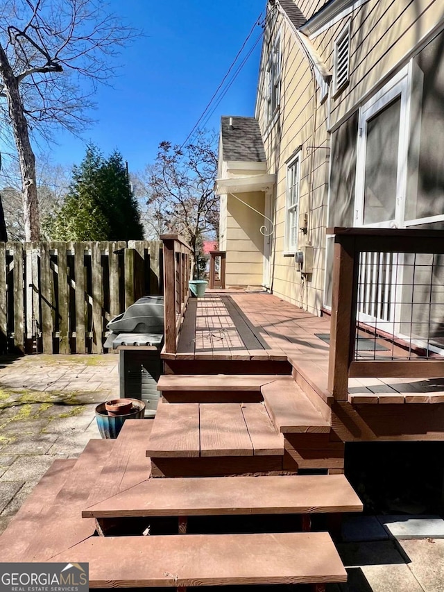 wooden deck featuring fence and area for grilling