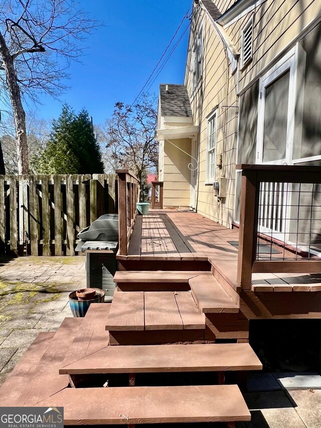 rear view of property with a sunroom and a yard