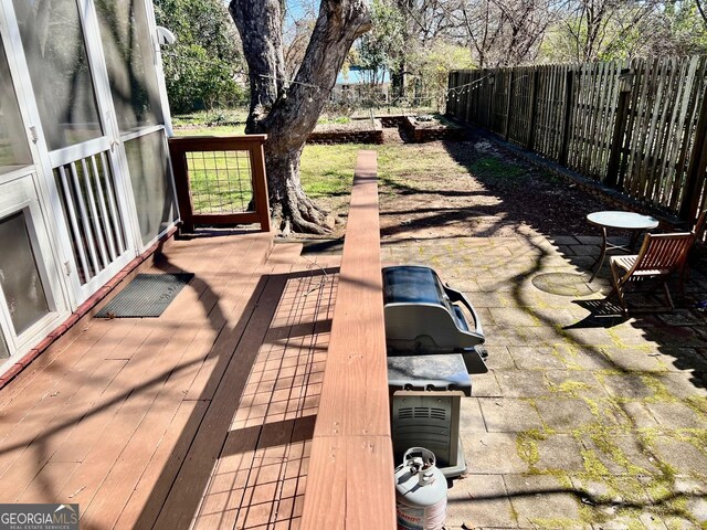 view of yard with an outbuilding, a patio, and a wooden deck