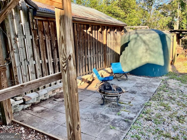 view of patio / terrace with a fire pit