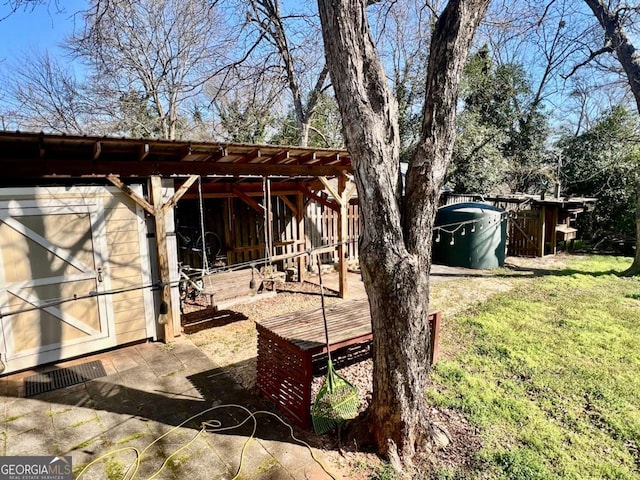 view of yard featuring an exterior structure and an outdoor structure