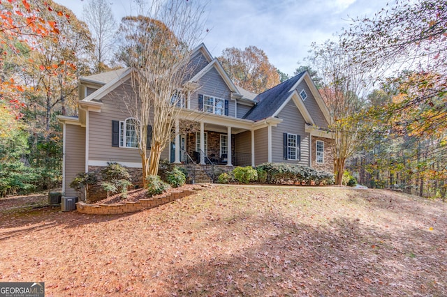 view of front of property with covered porch and stone siding