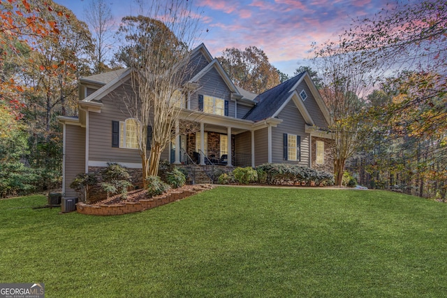 view of front of home featuring a front yard and a porch