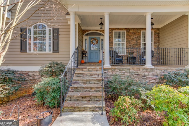 doorway to property with a porch