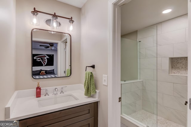 ensuite bathroom with vanity, a shower stall, recessed lighting, and ensuite bathroom