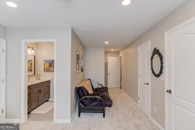 living area with recessed lighting, baseboards, and light carpet