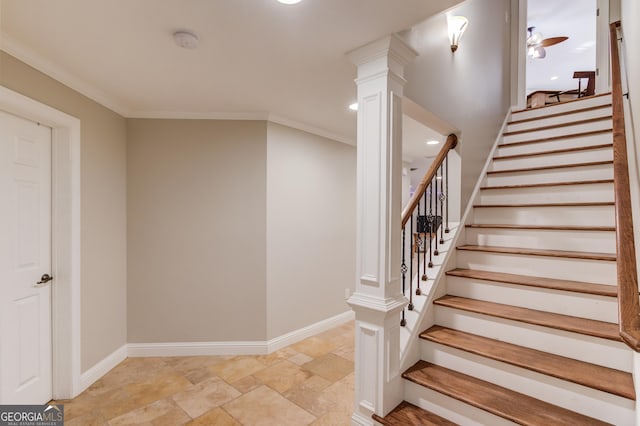 staircase with a ceiling fan, stone finish floor, crown molding, decorative columns, and baseboards