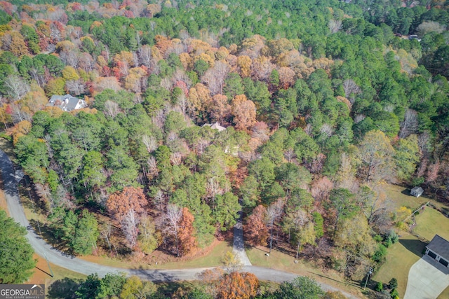 drone / aerial view with a view of trees