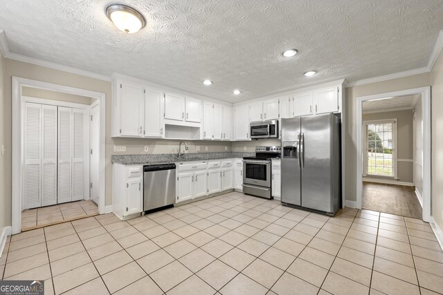 unfurnished room with baseboards, ornamental molding, dark wood finished floors, and a textured ceiling