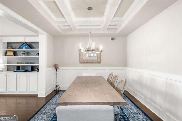 dining room with visible vents, coffered ceiling, dark wood-style flooring, beamed ceiling, and an inviting chandelier