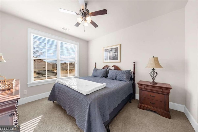 bedroom featuring light carpet, ceiling fan, visible vents, and baseboards