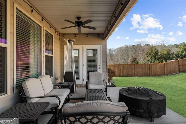 view of patio with a grill, fence, an outdoor hangout area, and ceiling fan